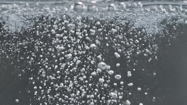Bubbles Rising in Water Closeup Macro Shot.