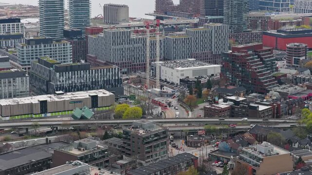 Cinematic high angle shot of Toronto downtown and the Gardiner Expressway, urban development, residential buildings, modern architectural design of Canada