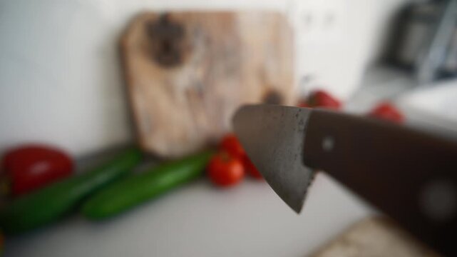 Chef Selects Vegetables For Chopping With A Kitchen Knife In The Kitchen, Object POV camera angle shot