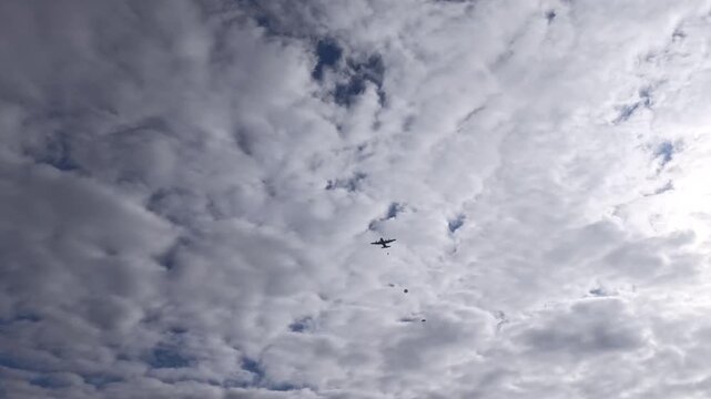 A military transport plane dropping paratroopers