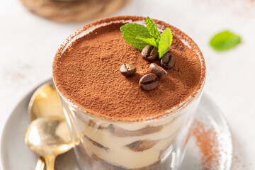 Gourmet Tiramisu Dessert in Glass with Mint Leaf © anammarques