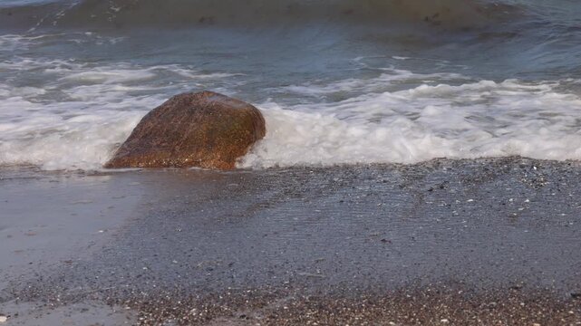 Ocean waves washing over a rocky seashore