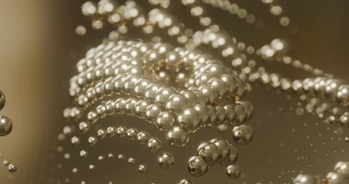 Abstract metallic spheres and bead chains with golden bokeh looping animation