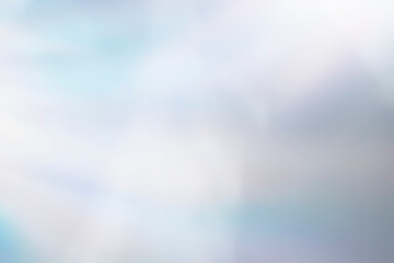 Fototapeta premium Ethereal pastel blue and white blurred bokeh background with soft dreamy textures