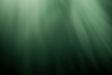 Soft cinematic green light beams illuminating a dark atmospheric background with smooth volumetric glowing effects © Jess rodriguez