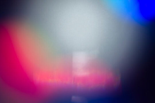 Intense red and magenta light bleed overlay with deep blue vignette