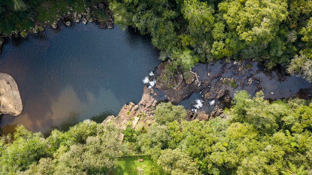 Aerial view of Parque Natural Municipal Gruta India waterfall and forest in Garuhap&eacute;, Misiones.