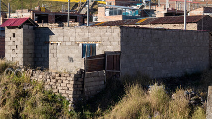 Fototapeta premium Traditional adobe houses and rural architecture in the highlands of Macusani, Puno, Peru.
