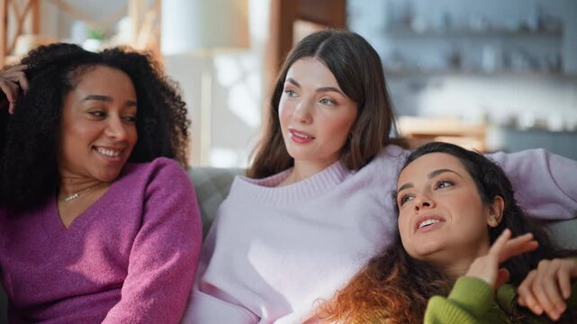 Three girls friends laughing enjoying carefree friendly gathering home closeup. 