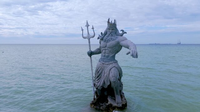 Greek God Poseidon Statue inside the Ocean at Progreso Beach Yucatan. Mexico.