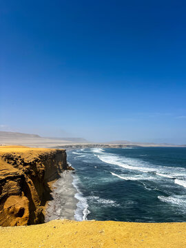 Stunning coastal cliffs and ocean waves at Paracas National Reserve