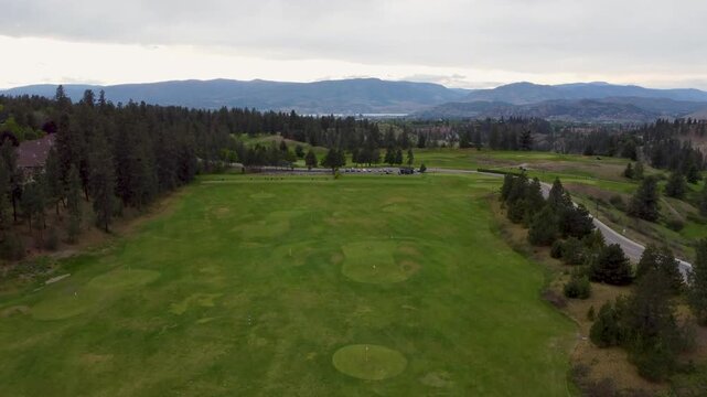 Rising Crane drone aerial on golf course driving range Kelowna