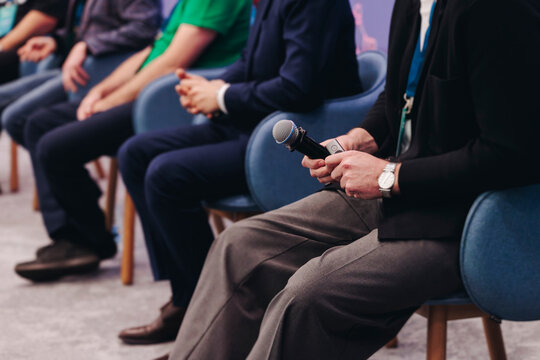 Panel discussion at conference, group of speakers debate at the business conference event, audience on forum summit, plenary session in lecture hall, persons on a stage, business congress at the venue
