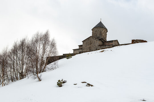 The Gergeti Trinity Church is a stunning 14th-century Georgian Orthodox church perched on a 2,170-meter 