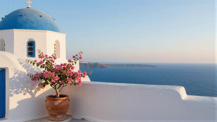 Fototapeta premium Blue-domed church pink flowers white walls overlooking the sea.