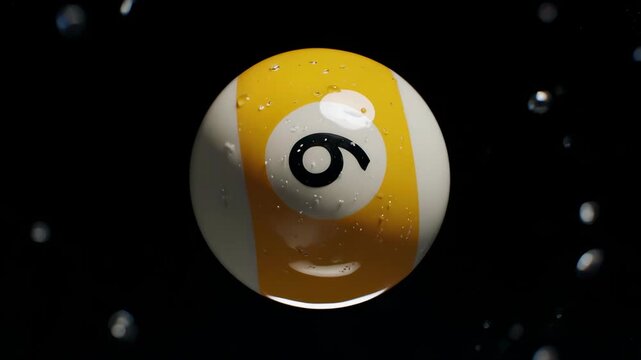 Yellow 9-Ball Billiard Covered in Water Droplets and Bubbles on Black Background