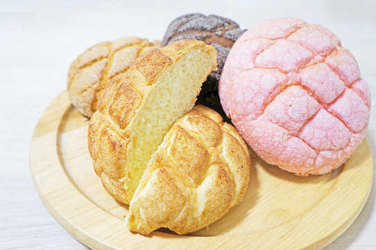 Colorful Melon Bread Assortment on Wooden Plate