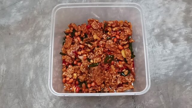 A traditional dish from Solo, Indonesia, called Tempe Orek Kering, is made from tempeh that is sliced thinly lengthwise or shaped like a matchstick, then fried until dry and crispy