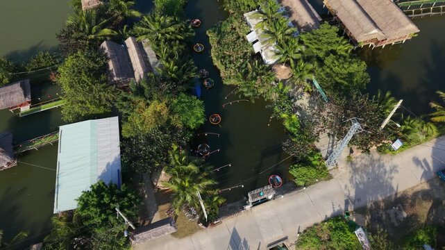 Boats By River. Traditional Boats By Riverside Activity. Clustered Round Boats Near Tranquil Water Routes. Riverfront Scene With Local Boats And Bustling Market Surroundings