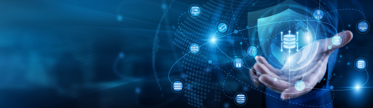 Analyst hand-holds Big Data global network information and sets. Scientist working on laptop processing complex statistics and insights. Massive storage and digital pattern recognition.