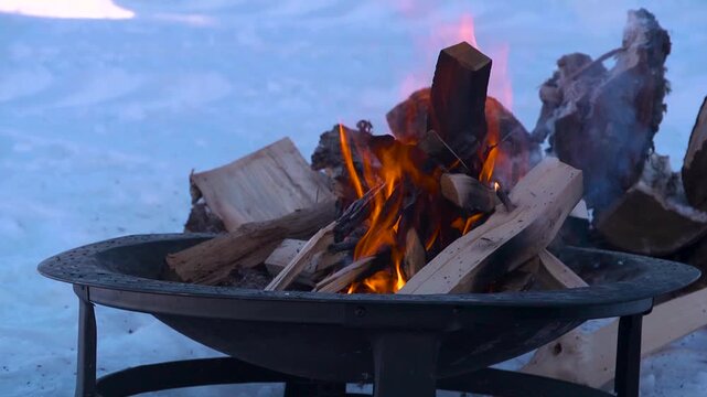 wood burning on a frozen lake in alaska