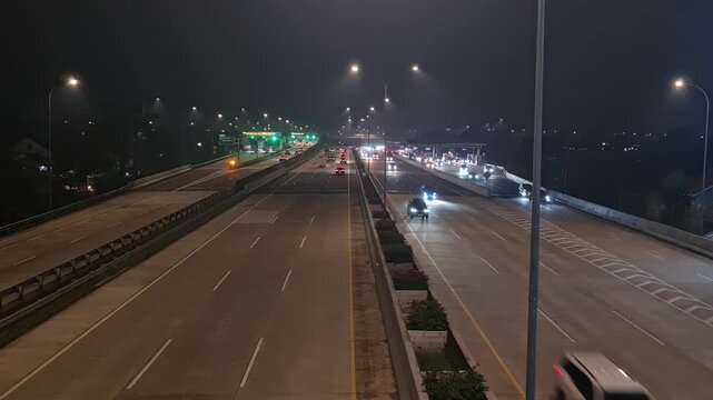 Busy Highway Toll Road at Night in Depok Indonesia for Transportation and Urban Logistics Background