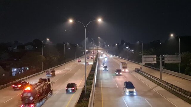 Busy Highway Toll Road at Night in Depok Indonesia for Transportation and Urban Logistics Background