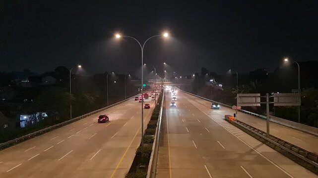 Busy Highway Toll Road at Night in Depok Indonesia for Transportation and Urban Logistics Background