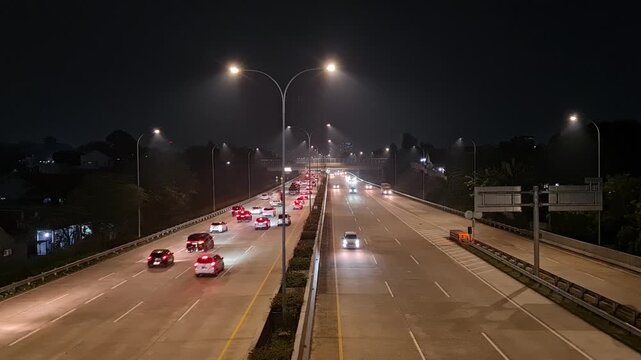 Busy Highway Toll Road at Night in Depok Indonesia for Transportation and Urban Logistics Background