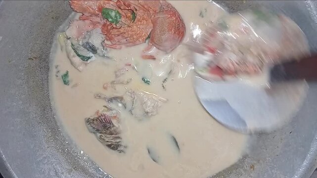 Eating Seafood Coconut Curry Cooked on Kerosene Stove