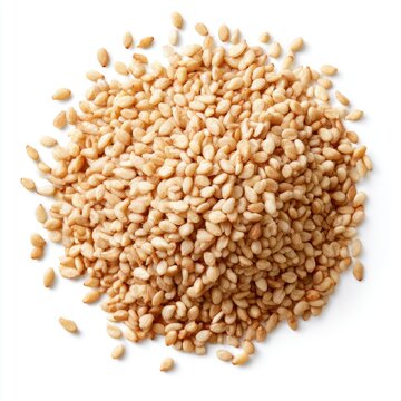 A pile of light brown sesame seeds scattered on a white background.