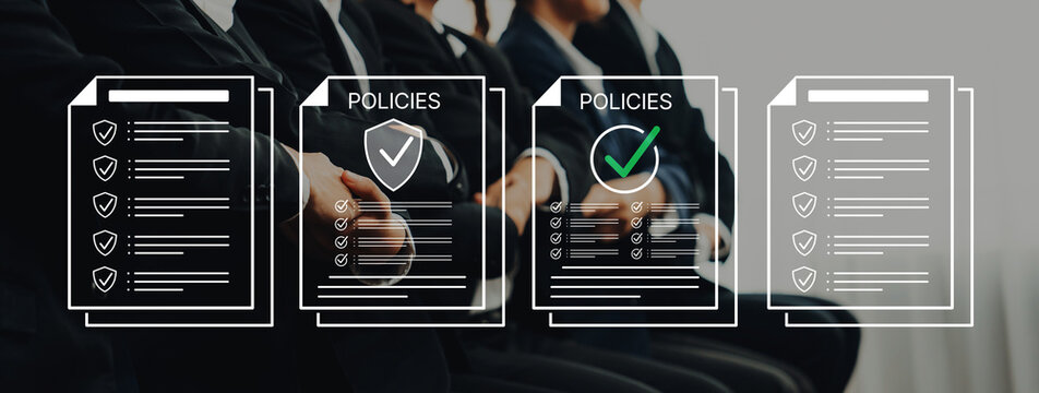 Business Meeting on Policy Review with Documents, Checklists, and Professionals in Suits Participating in Discussion on Compliance and Regulations. Bitwise.