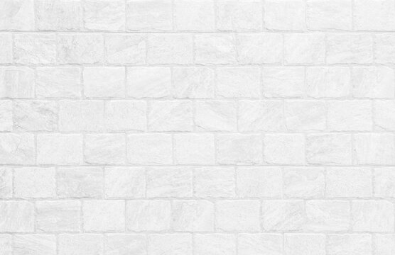 Kitchen wallpaper concept: Close up modern white brick tiles wall texture background, White brick wall texture background for stone tile block in grey light color wallpaper modern interior.
