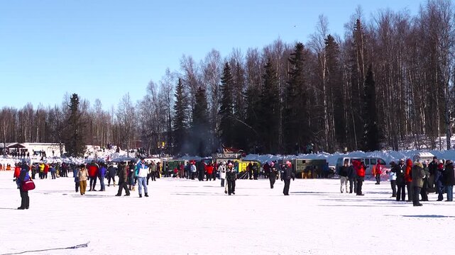 group of people walking in snow