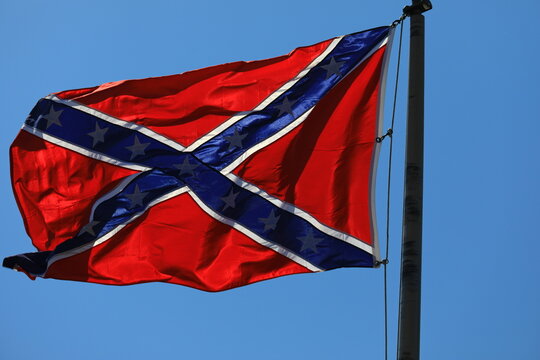 Confederate flag on a clear blue sky
