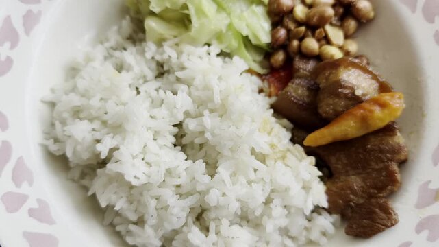 Indonesian Pork Rice with Peanuts and Fried Cabbage (Nasi Babi)