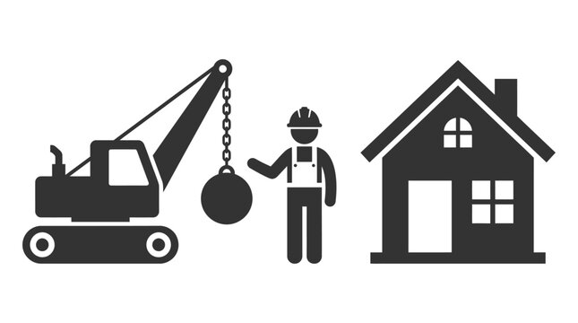 Construction worker operating a wrecking ball crane next to a house
