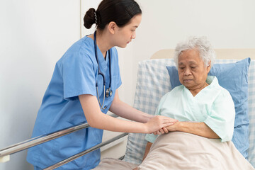 Fototapeta premium Asian doctor checking and treat elderly woman patient health in hospital.