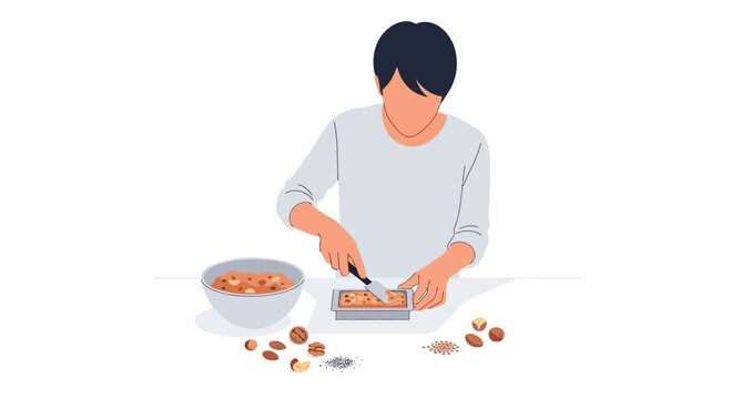 Person preparing healthy homemade nut bars, chopping ingredients on a cutting board