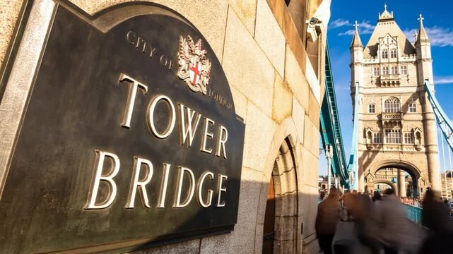 Tower Bridge in London, UK, United Kingdom. Time lapse. People walking.