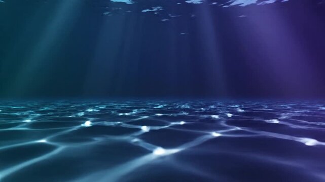 Underwater scene with sunbeams piercing the deep blue ocean water creating mesmerizing light patterns on the sandy seabed evoking tranquility and mystery slow motion footage