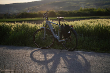 Fototapeta premium Bicycle in sunset on a rural road.