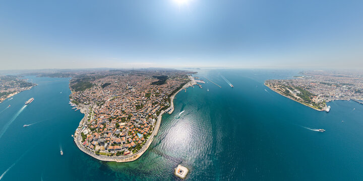 Istanbul, Turkey. Wide panoramic view of Maiden's Tower in Bosphorus with Golden Horn, historic peninsula, cruise liners and passenger ferries. Aerial view.