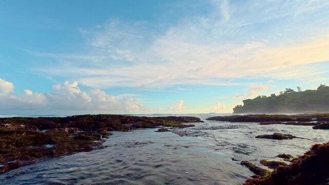 Rocky coastal pools with pastel sky reflections