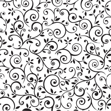 Seamless pattern with black and white floral design elements, swirly tendrils with leaves.