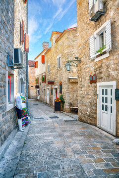 Amazing view of Old Town Citadela with paved narrow street in the Budva city.