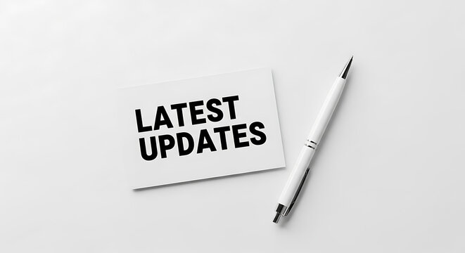 White pen and pencil with text latest updates on white background