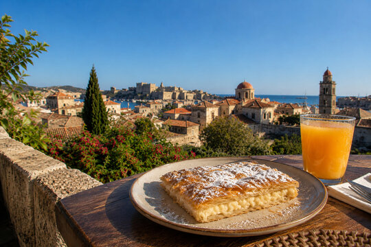 Authentic Greek Bougatsa Pastry and Orange Juice on Scenic Rhodes Terrace Morning