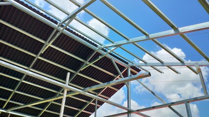 Fototapeta premium Metal Roof Structure of Frame House Under Construction