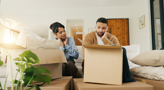 Boxes, couple and tired with stress in new home for relocation fatigue, clutter overload or moving. Real estate, people and overwhelmed with items on sofa for unpacking burnout, workload or struggle
